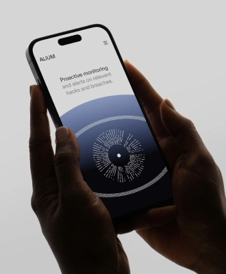 Person holding a smartphone displaying a privacy settings screen.